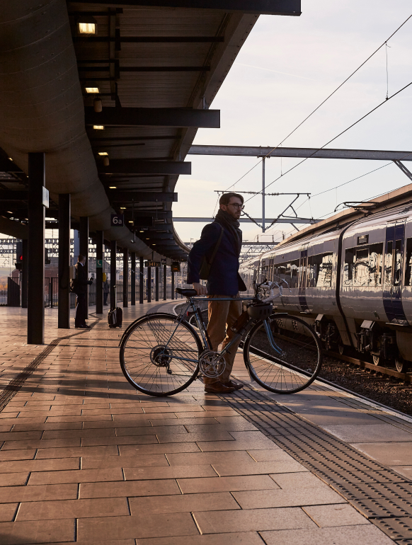 Cyclist Waiting on Train Station