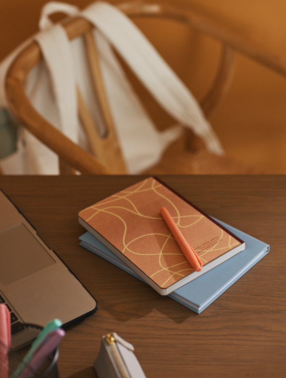 Notepad and Stationary on Table